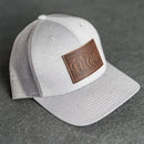Leather Patch Performance Style Trucker Hat - Mom Cursive Stamp