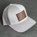 Your Logo on a Leather Patch Performance Style Trucker Hat